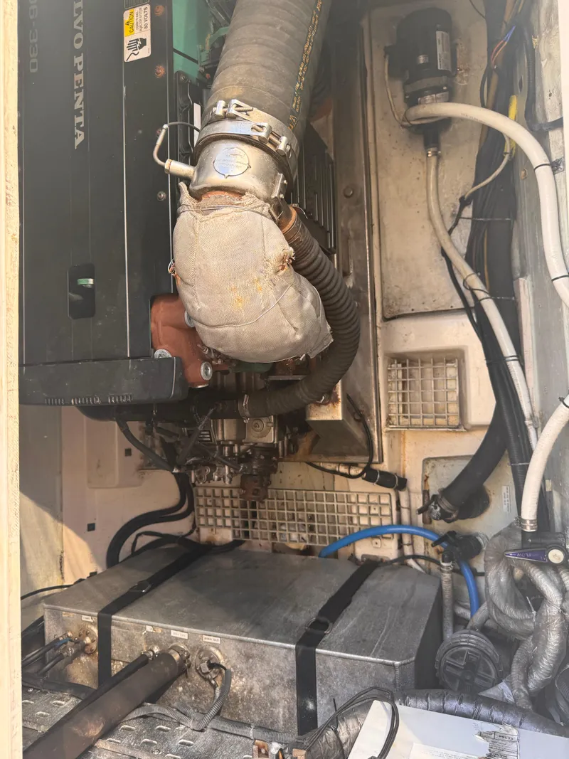 Slide: The Image of Engine compartment of a 2018 Aquila 48 yacht, featuring a Volvo Penta engine. - 29