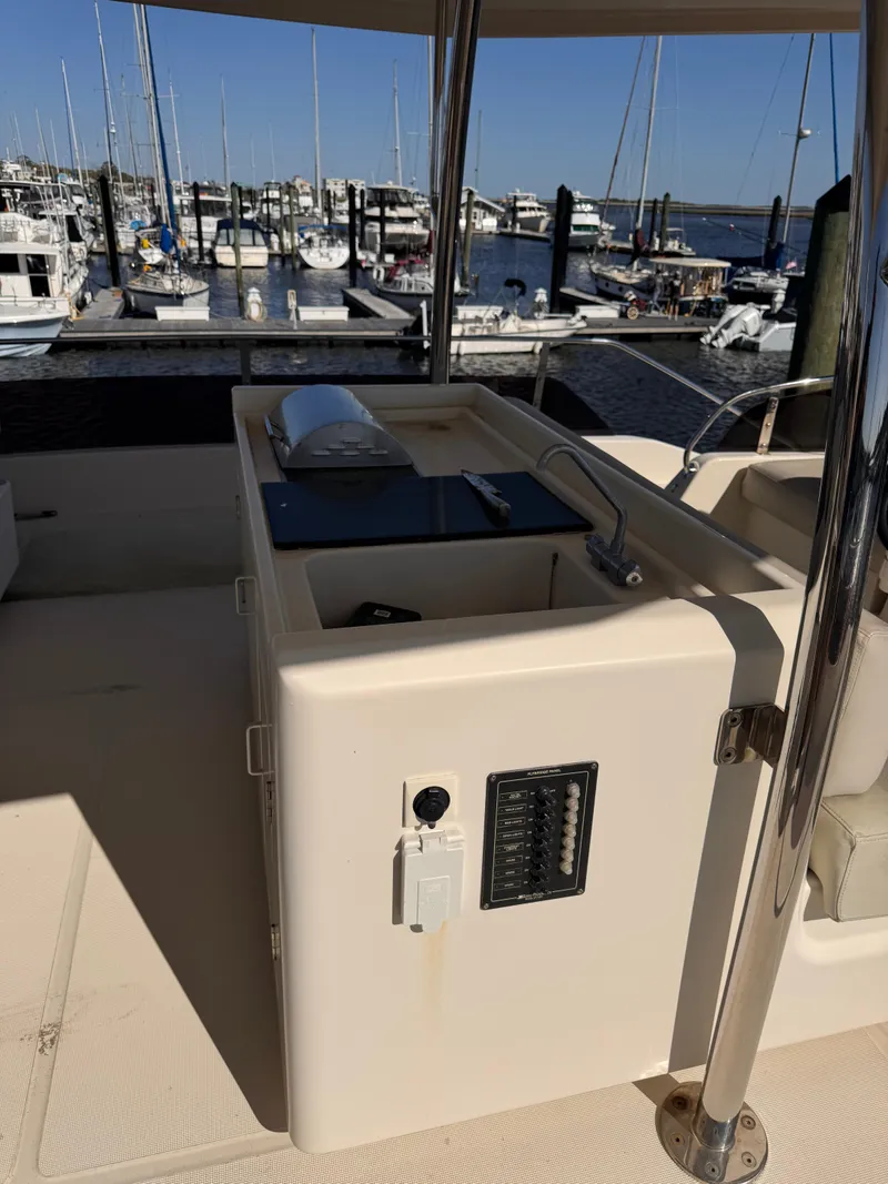 Slide: The Image of Aquila 48 yacht deck with sink and marina view, 2018 model. - 44