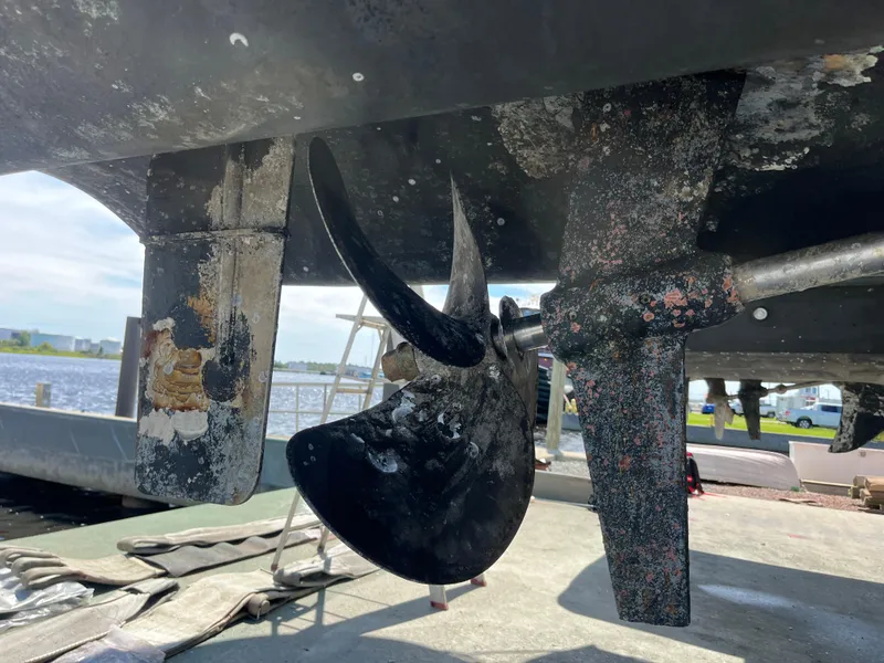 Slide: The Image of Aquila 48 yacht propeller and rudder, 2018 model, docked for maintenance. - 7