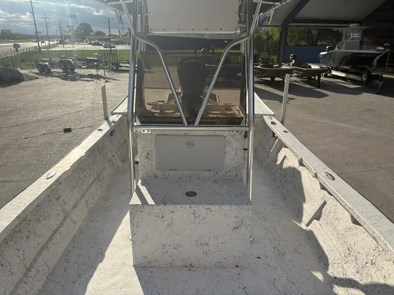 Slide: The Image of Open deck of a 2000 Skiff Reno 23 boat, parked outdoors. - 10