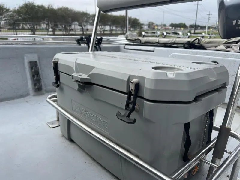 Slide: The Image of Gray cooler on a 2014 Blue Wave 2200 boat deck, secured with metal frame. - 14