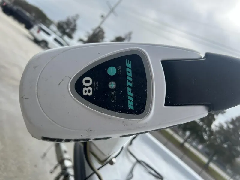 Slide: The Image of Riptide 80 trolling motor on 2014 Blue Wave 2200 boat, outdoor setting. - 16