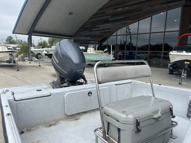 Slide: The Image of 2014 Blue Wave 2200 boat with Yamaha 115 engine, parked near showroom. - 18