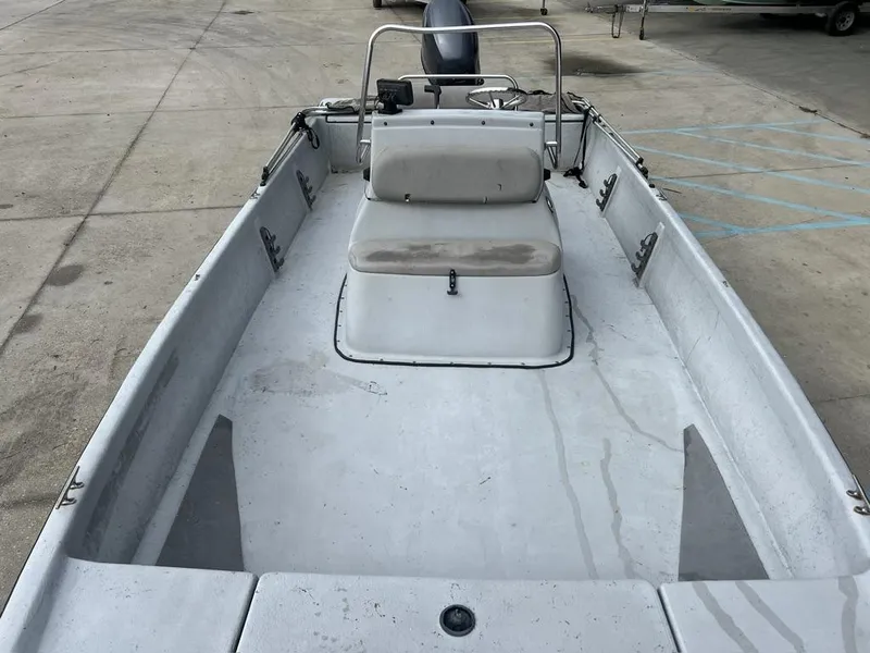 Slide: The Image of 2014 Blue Wave 2200 boat interior with seating and steering console. - 4