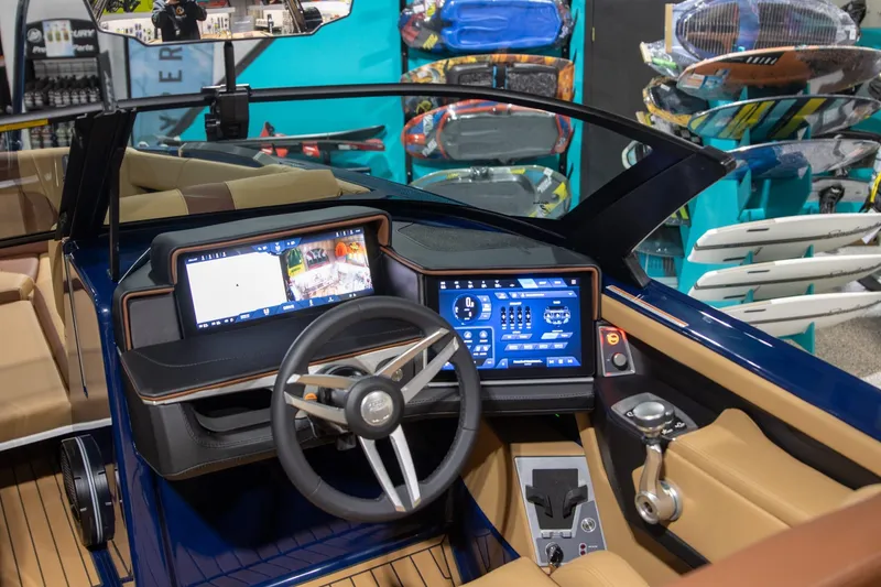 Slide: The Image of 2025 MasterCraft X24 boat dashboard with advanced digital controls and steering wheel. - 5