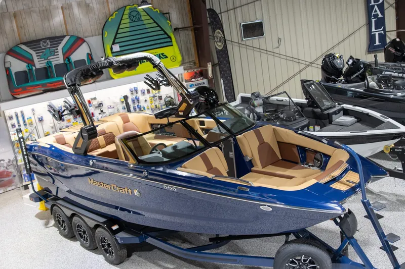 Slide: The Image of 2025 MasterCraft X24 boat in showroom, featuring sleek design and luxurious interior. - 8
