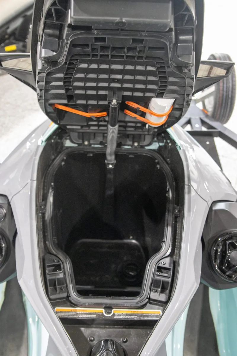 Slide: The Image of 2023 Sea-Doo Wake Pro 230 Tech Package storage compartment open, showcasing interior space. - 8
