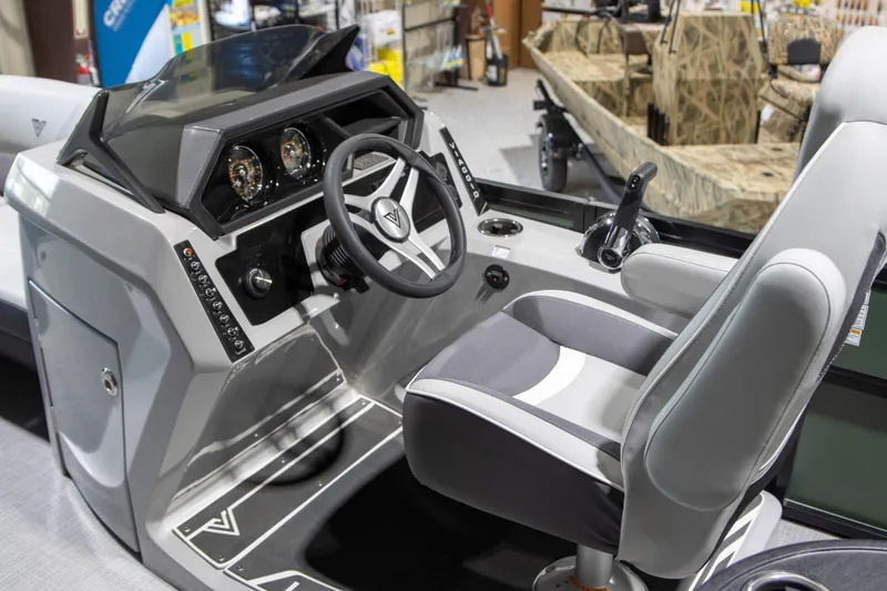 Slide: The Image of 2024 Viaggio Lago Z 22Q boat cockpit with modern steering and controls. - 6