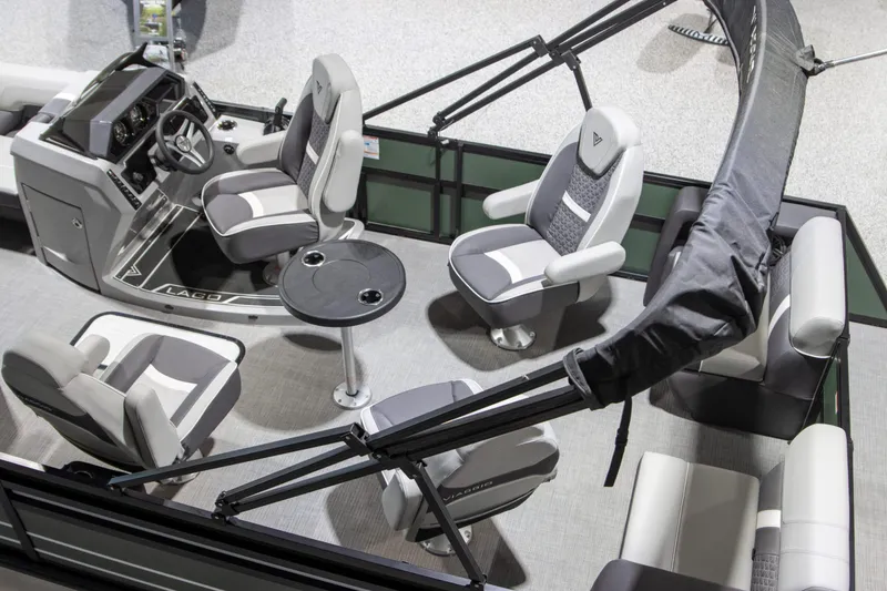 Slide: The Image of 2024 Viaggio Lago Z 22Q pontoon boat interior with modern seating and helm. - 8