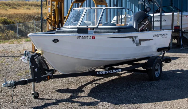 Slide: The Image of 2023 Crestliner 1600 Vision boat on trailer, parked outdoors. - 10