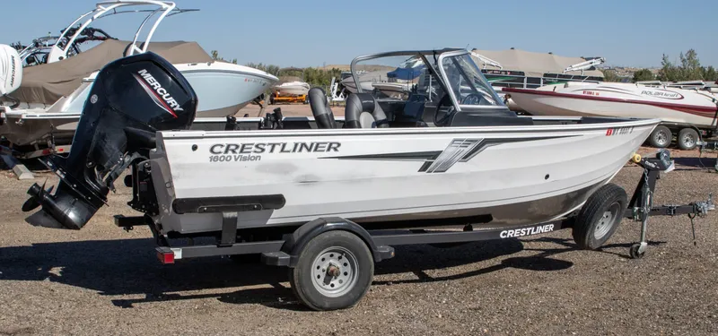 Slide: The Image of 2023 Crestliner 1600 Vision boat on trailer, featuring a Mercury outboard motor. - 5