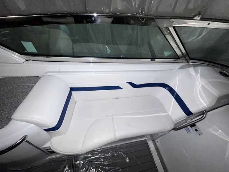 Slide: The Image of 2007 Formula 330 SS boat interior with white and blue seating. - 6