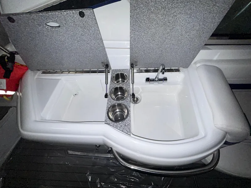 Slide: The Image of 2007 Formula 330 SS boat sink with faucet and cup holders. - 8