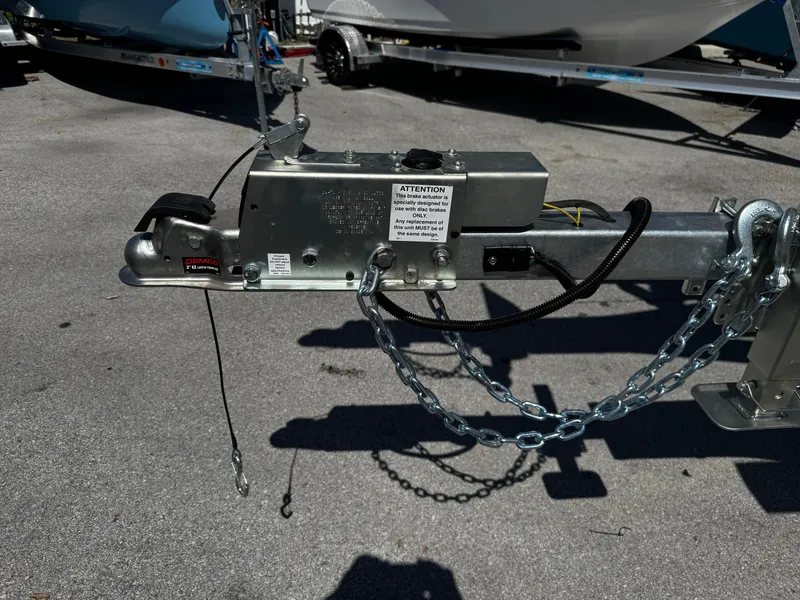 Slide: The Image of Trailer hitch with safety chains and brake mechanism, 2025 model 17-30. - 13
