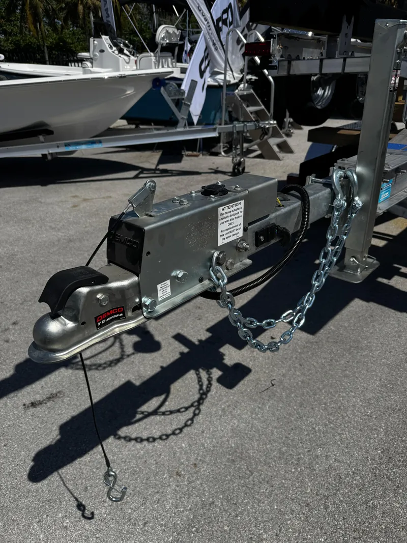 Slide: The Image of 2025 Trailer 17-30 hitch with safety chains and coupler on display. - 3
