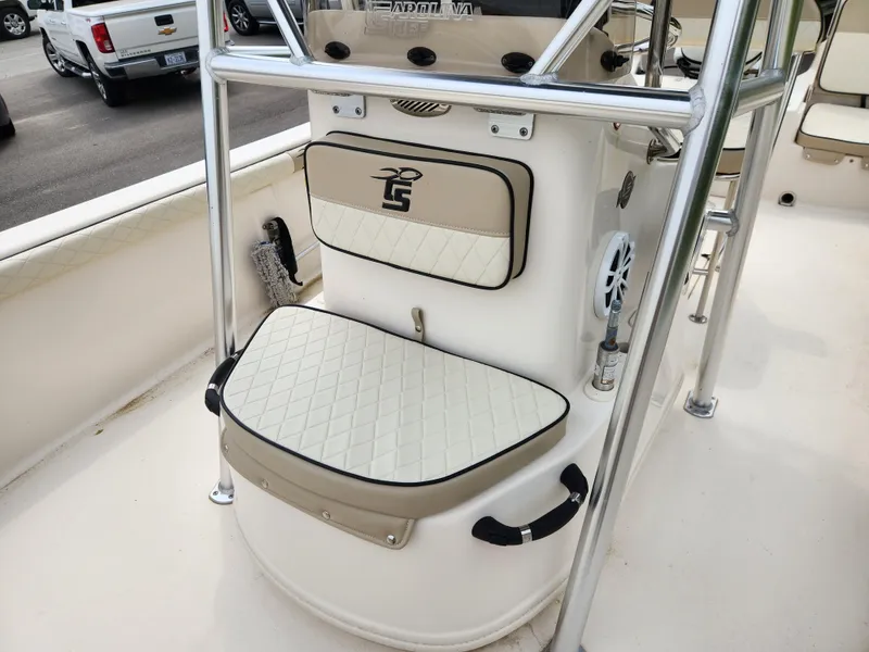 Slide: The Image of 2023 Carolina Skiff 21 LS boat interior with cushioned seating and stainless steel railings. - 10