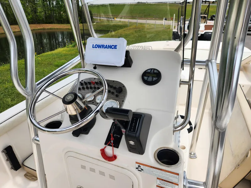Slide: The Image of 2023 Carolina Skiff 21 LS boat console with steering wheel and Lowrance navigation system. - 8