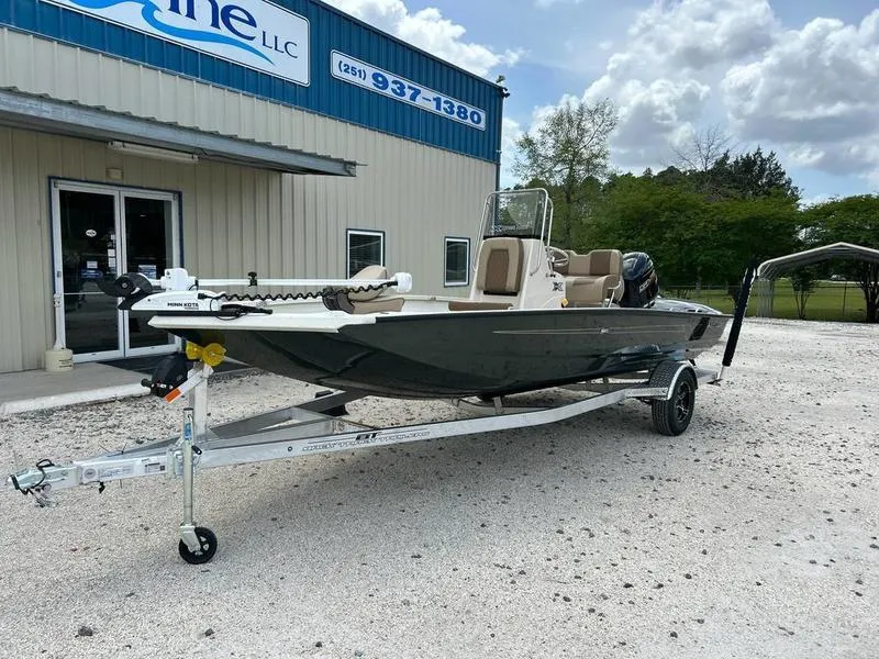 Slide: The Image of 2025 Xpress H20 BAY boat on trailer outside dealership, ready for adventure. - 13
