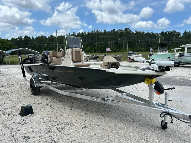 Slide: The Image of 2025 Xpress H20 BAY boat on trailer in outdoor lot, under cloudy sky. - 14