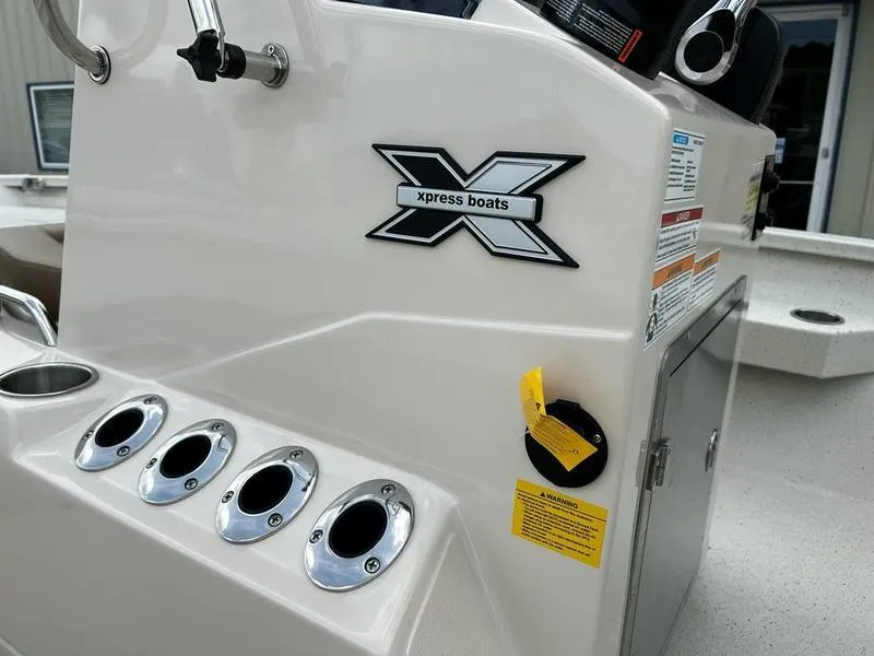 Slide: The Image of 2025 Xpress H20 BAY boat console with logo and control panel. - 15