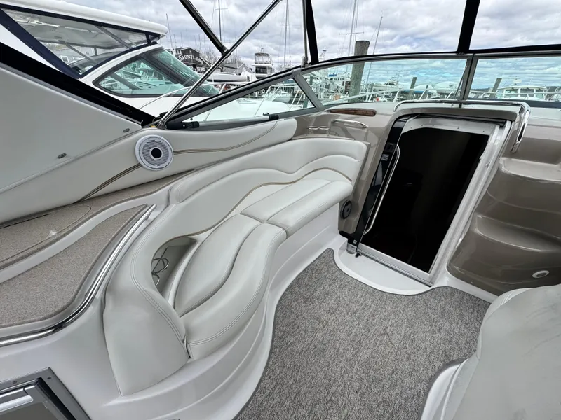 Slide: The Image of 2005 Larson 370 Cabrio boat interior with plush seating and modern design. - 8