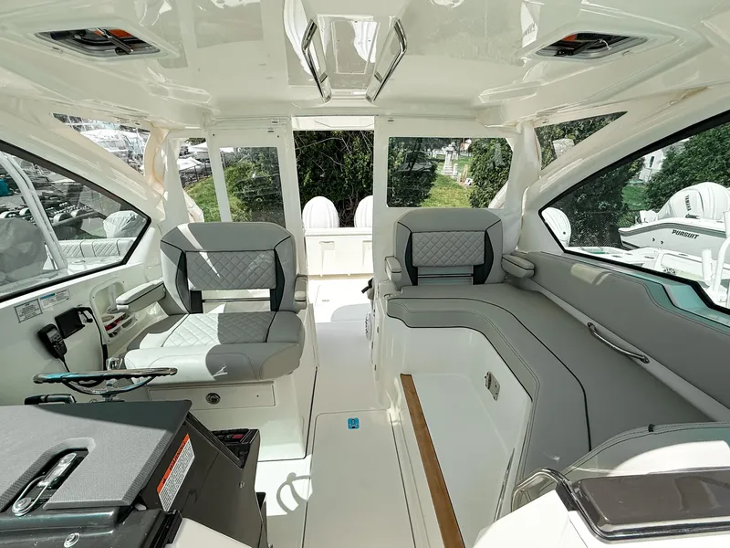Slide: The Image of 2025 Pursuit DC 326 Dual Console interior with modern seating and sleek design. - 20
