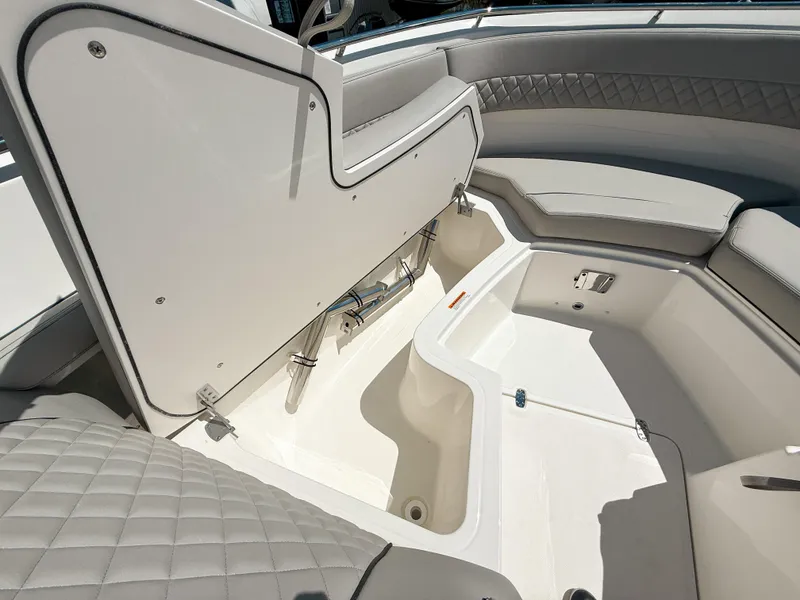 Slide: The Image of 2025 Pursuit DC 326 Dual Console boat interior storage compartment. - 28