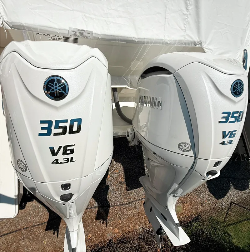 Slide: The Image of Twin Yamaha 350 V6 outboard engines on a 2025 Pursuit DC 326 Dual Console boat. - 3