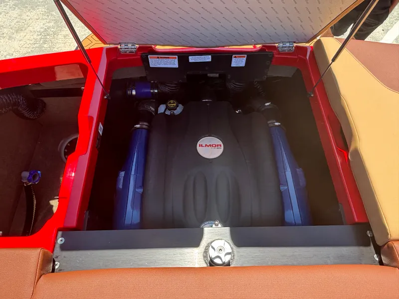 Slide: The Image of 2025 MasterCraft NXT24 engine compartment with Ilmor engine, open hatch view. - 14