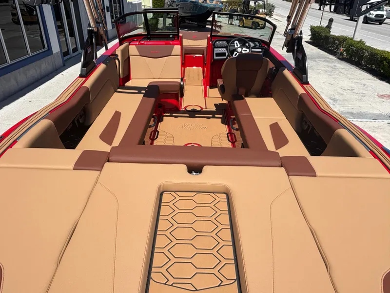 Slide: The Image of 2025 MasterCraft NXT24 boat interior with tan upholstery and modern design. - 5
