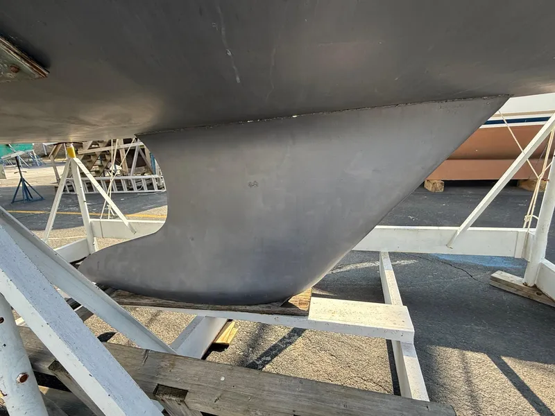 Slide: The Image of Keel of a 2002 Beneteau 331 sailboat on a support stand. - 13
