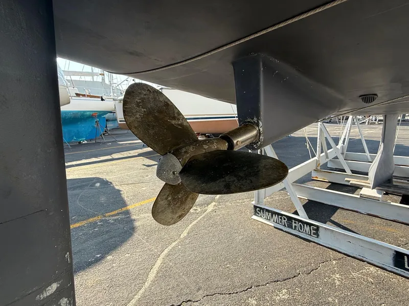 Slide: The Image of Propeller of 2002 Beneteau 331 sailboat on dry dock, showcasing marine hardware. - 14