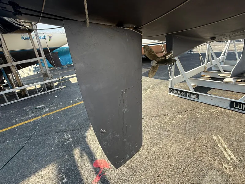 Slide: The Image of Rudder and propeller of a 2002 Beneteau 331 sailboat on a dry dock. - 17