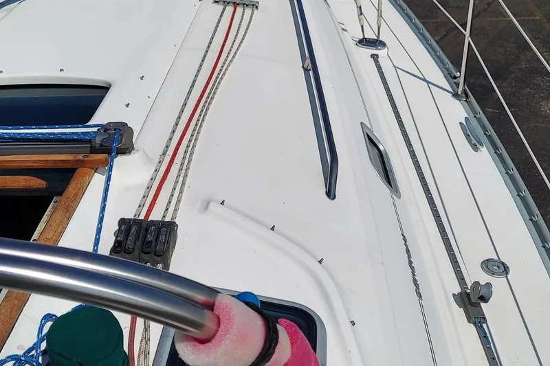 Slide: The Image of Deck of a 2002 Beneteau 331 sailboat with ropes and hatch details. - 20