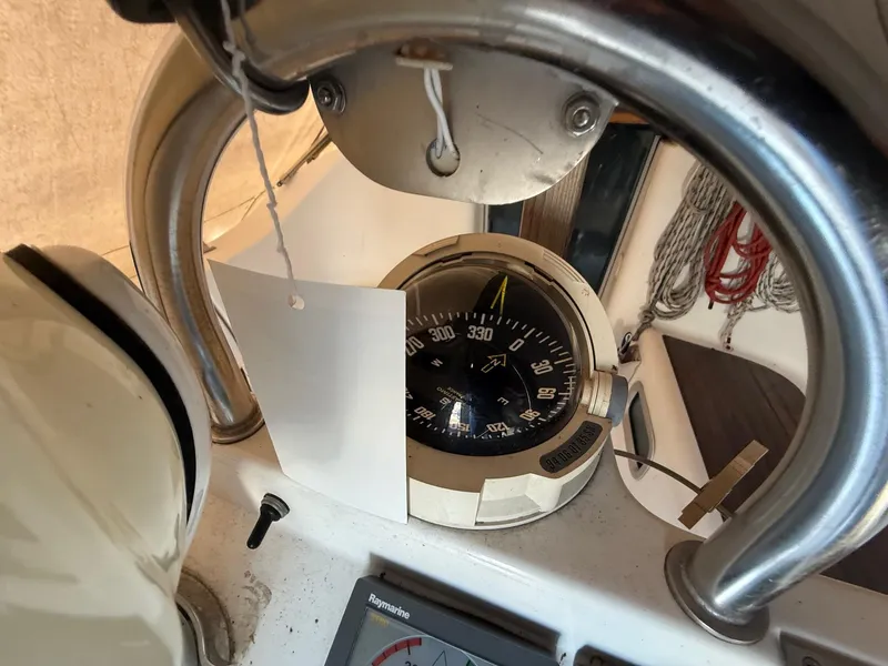 Slide: The Image of Compass and navigation equipment on a 2002 Beneteau 331 sailboat. - 24