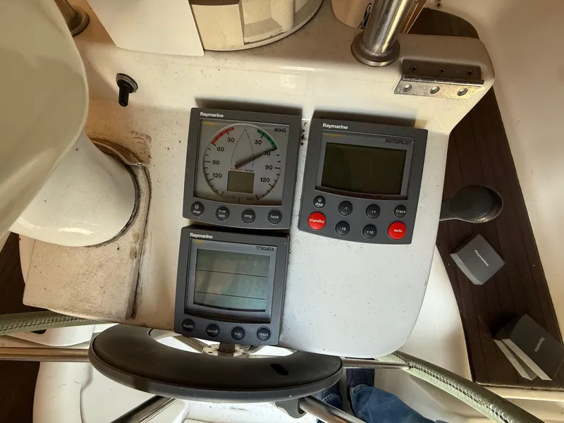 Slide: The Image of Beneteau 331 sailboat cockpit with Raymarine navigation instruments, 2002 model. - 26