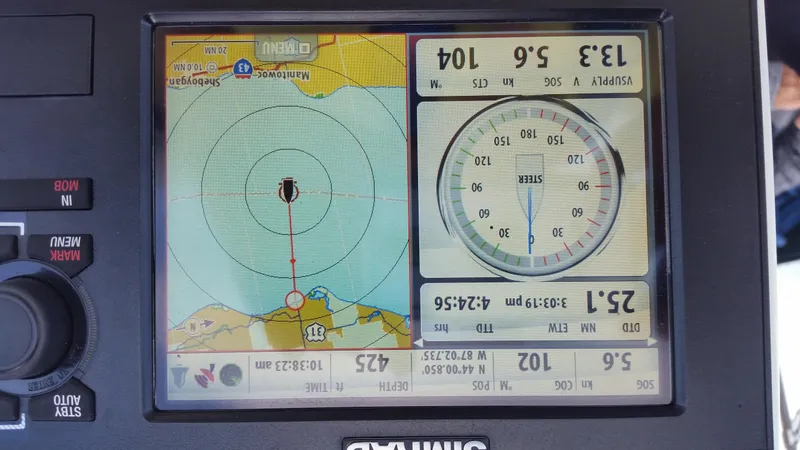 Slide: The Image of Navigation display on a 2002 Beneteau 331 sailboat showing map and compass. - 27