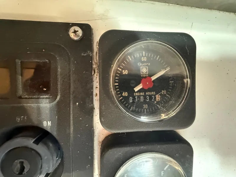 Slide: The Image of Close-up of a 2002 Beneteau 331 engine hour meter showing 1321 hours. - 29