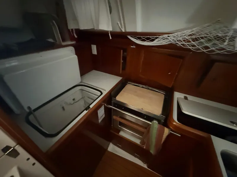 Slide: The Image of Interior of 2002 Beneteau 331 sailboat kitchen with stove and storage. - 37