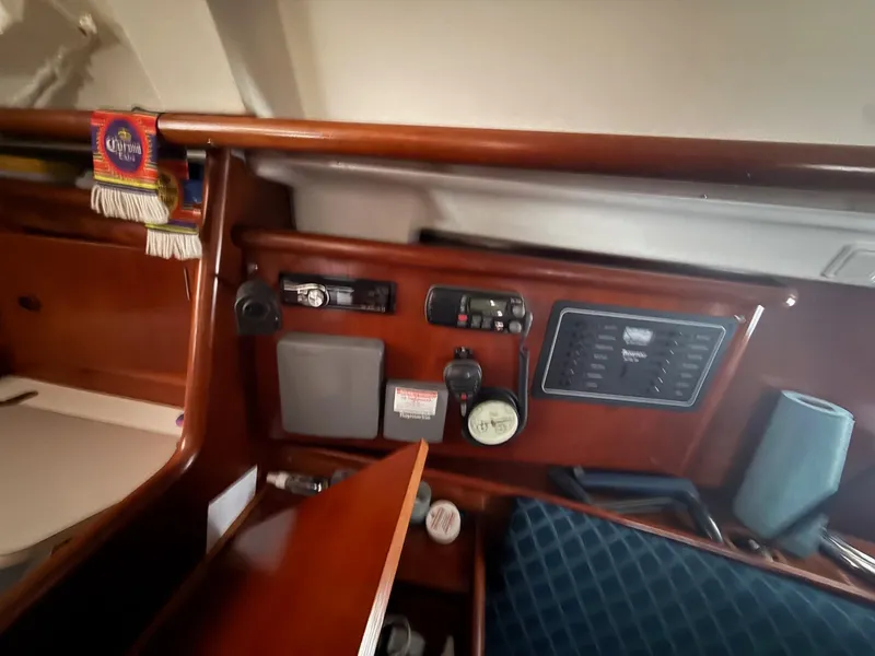 Slide: The Image of Interior view of a 2002 Beneteau 331 sailboat with navigation equipment. - 39