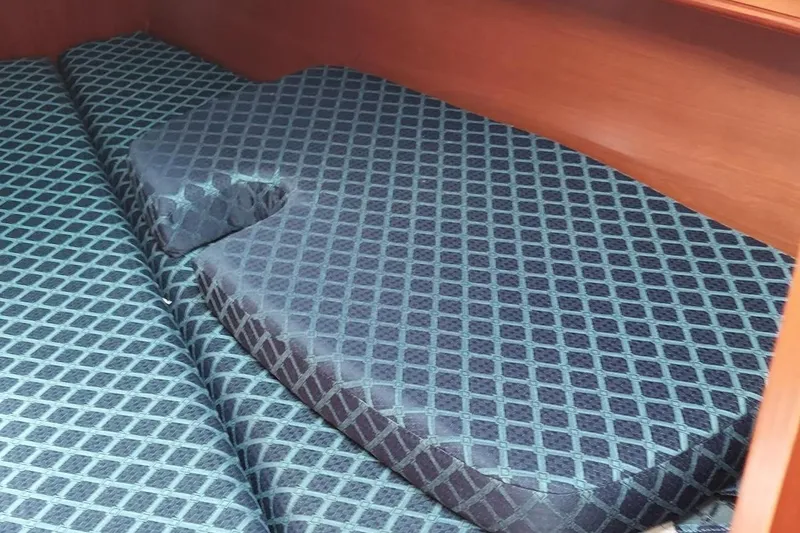 Slide: The Image of Cushioned interior of 2002 Beneteau 331 sailboat with patterned upholstery. - 45