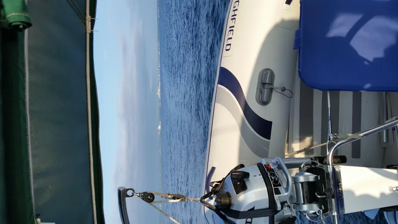 Slide: The Image of Sailing on a 2002 Beneteau 331 yacht with ocean view and inflatable boat. - 67