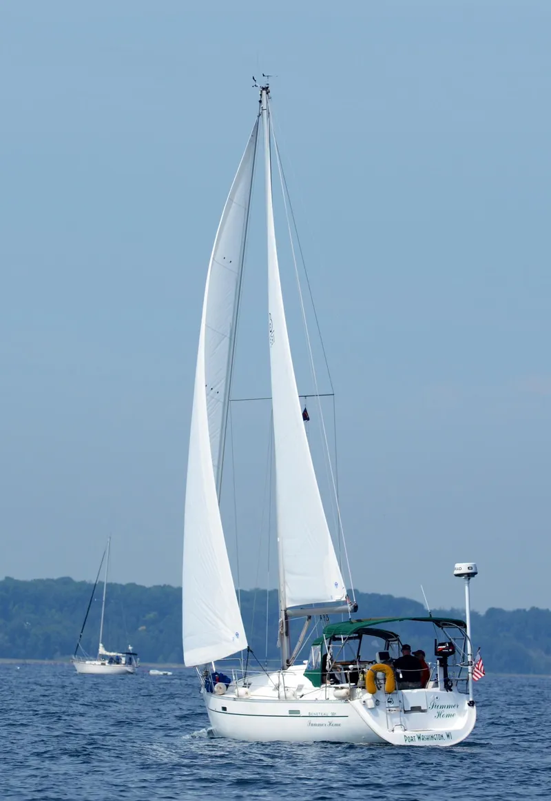 Slide: The Image of 2002 Beneteau 331 sailboat cruising on calm waters under clear blue skies. - 9