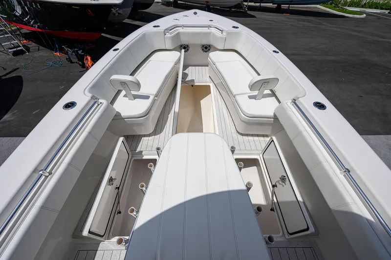 Slide: The Image of 2022 Contender 35 ST boat interior with seating and storage compartments. - 24