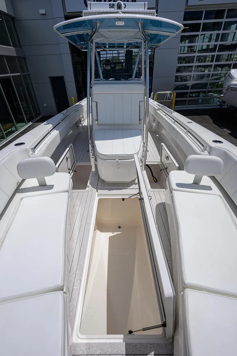 Slide: The Image of 2022 Contender 35 ST boat interior with spacious seating and storage compartments. - 26