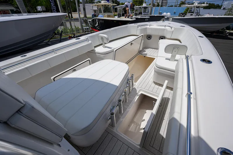Slide: The Image of 2022 Contender 35 ST boat interior with seating and storage compartments. - 27
