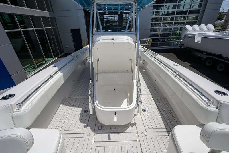 Slide: The Image of 2022 Contender 35 ST boat interior with open storage compartment, sleek design, and spacious layout. - 29