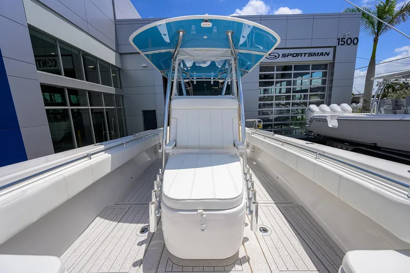 Slide: The Image of 2022 Contender 35 ST boat with sleek seating and modern design at a dealership. - 31