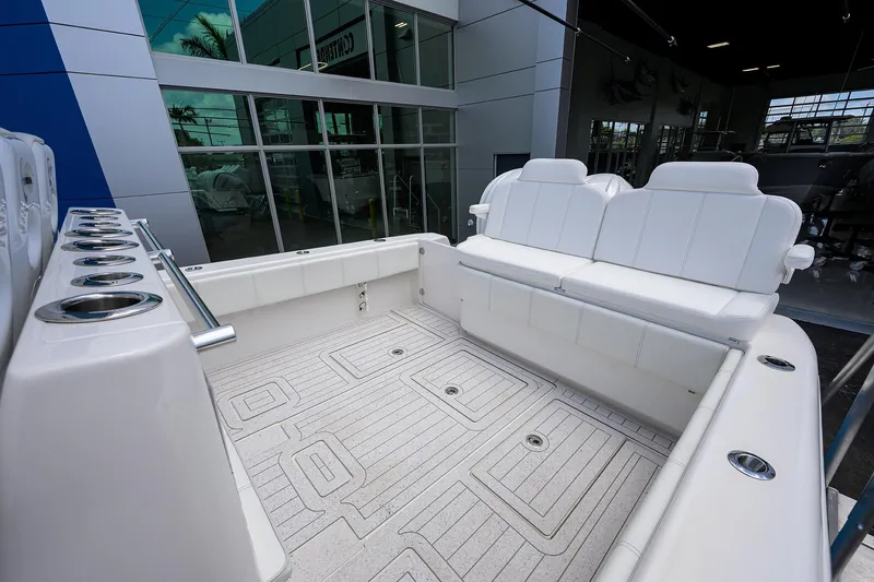 Slide: The Image of 2022 Contender 35 ST boat interior with white seating and spacious deck. - 34