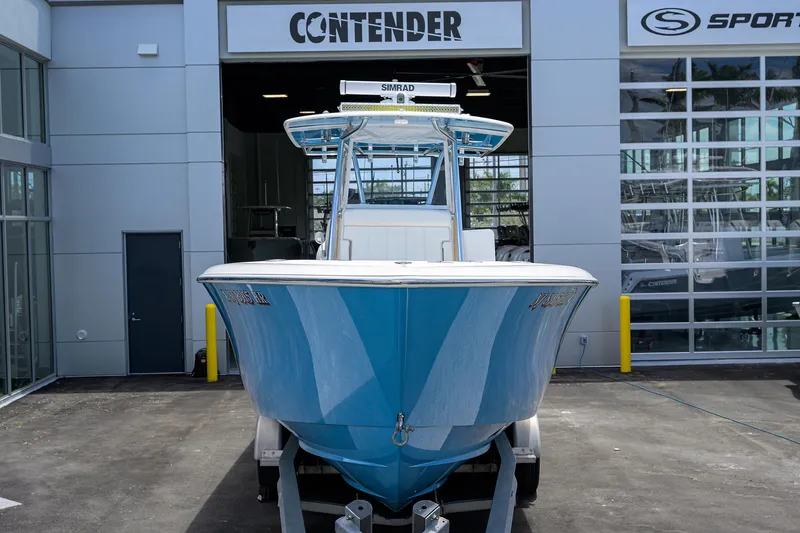 Slide: The Image of 2022 Contender 35 ST boat in blue, displayed at dealership entrance. - 4